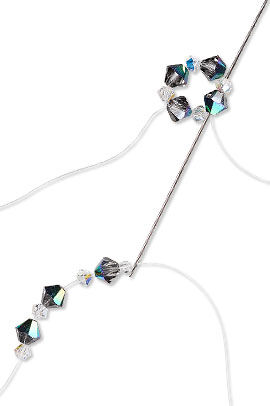 Crystal beads threaded with a needle